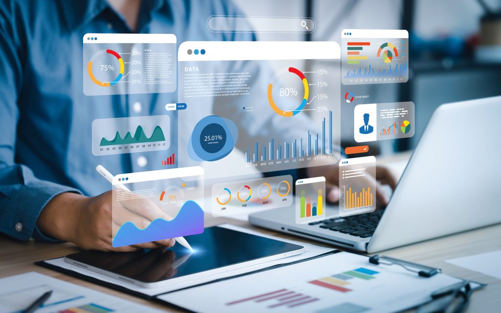 An analyst uses a computer and dashboard for data business analysis and Data Management System with KPI and metrics connected to the database for technology finance, operations, sales, marketing.